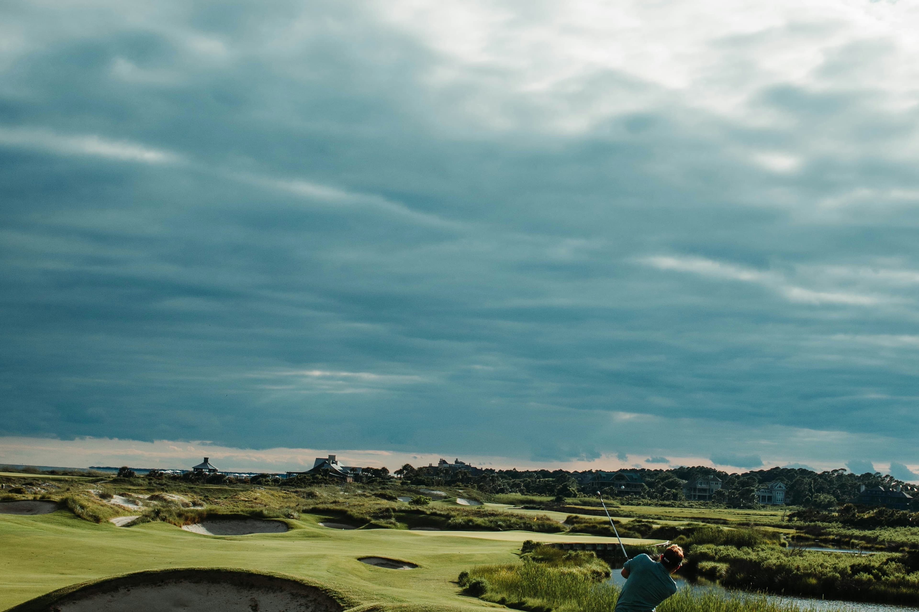 Manicured golf fairway and open sky for a polished golf holiday