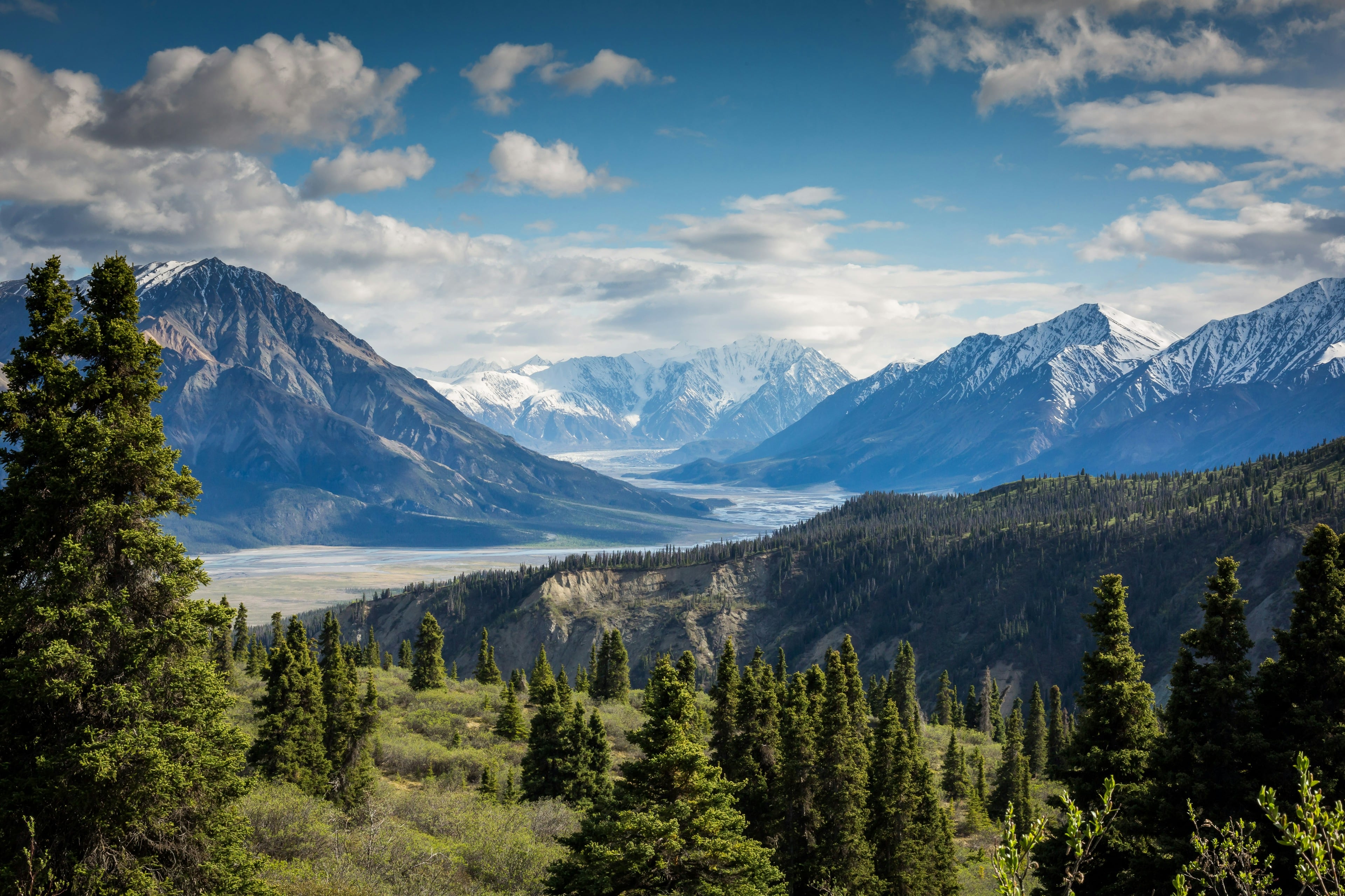 Layered mountain peaks and clear sky for refined adventure travel