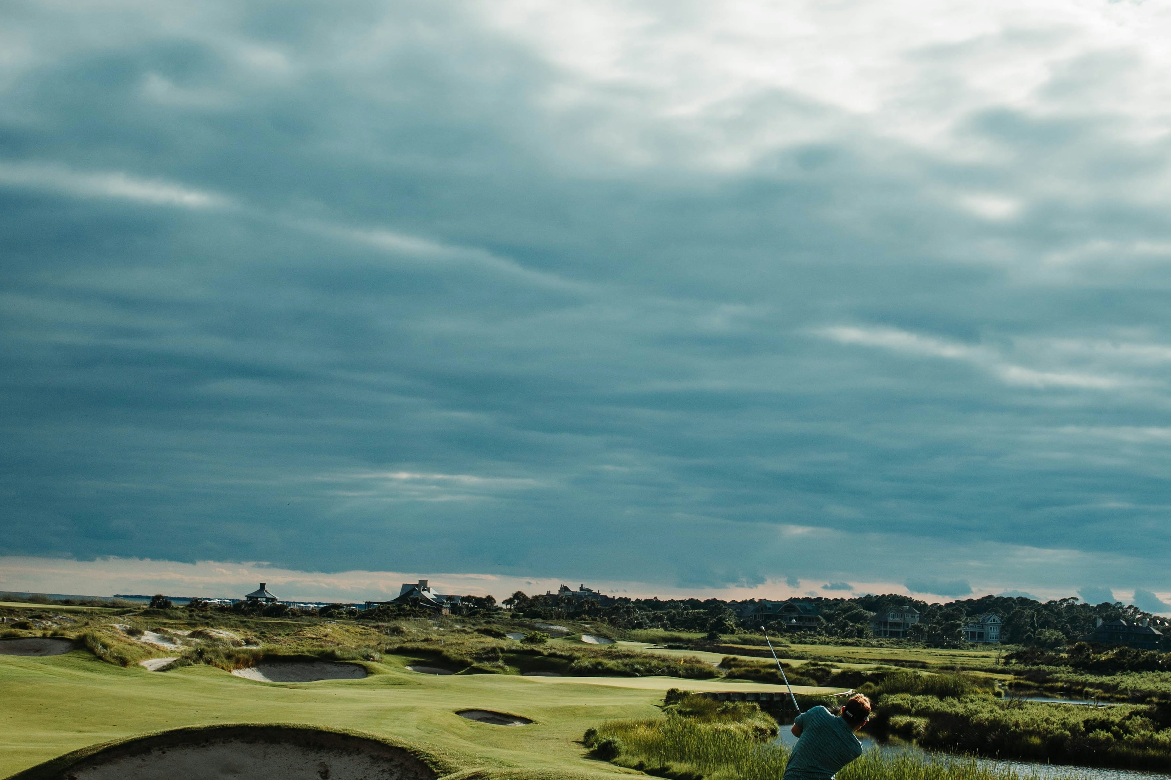 Manicured golf fairway and open sky for a polished golf holiday
